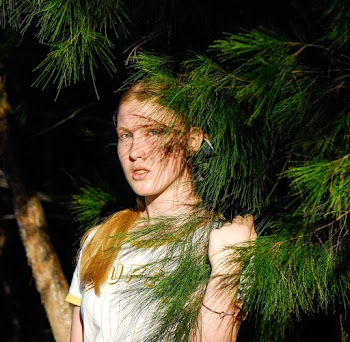 Photo Of Woman Holding Pine Leaves
