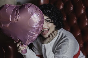 Photo Of Woman Holding Pink Heart Balloon