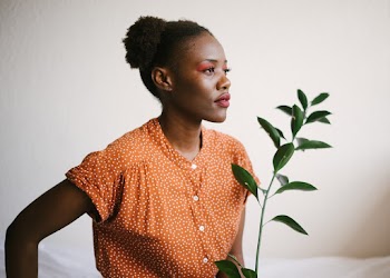 Photo Of Woman Holding Plant