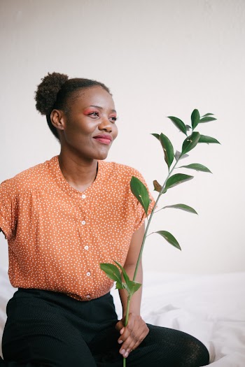 Photo Of Woman Holding Plant