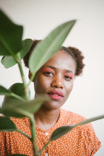 Photo Of Woman Holding Plant