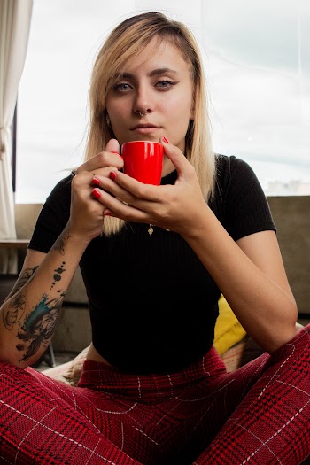 Photo of Woman Holding Red Cup