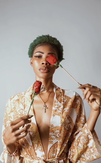 Photo of Woman Holding Roses