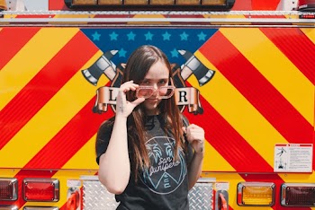 Photo Of Woman Holding Shades