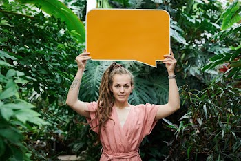 Photo Of Woman Holding Sign Board