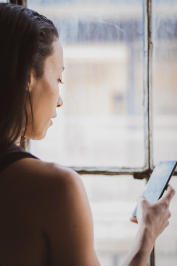 Photo of Woman Holding Smartphone