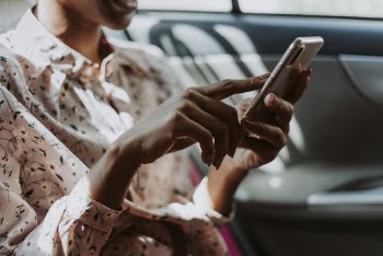 Photo of Woman Holding Smartphone