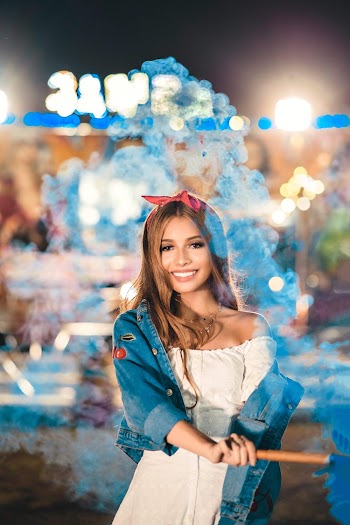 Photo of Woman Holding Smoke Bomb