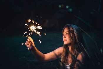 Photo of Woman Holding Sparkler