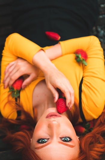 Photo Of Woman Holding Strawberry