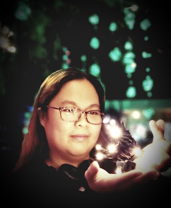 Photo of Woman Holding String Lights