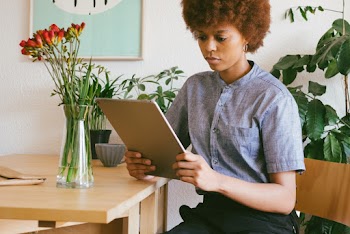 Photo Of Woman Holding Tablet