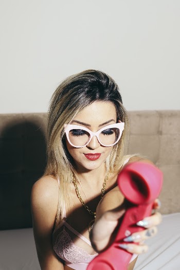 Photo of Woman Holding Telephone