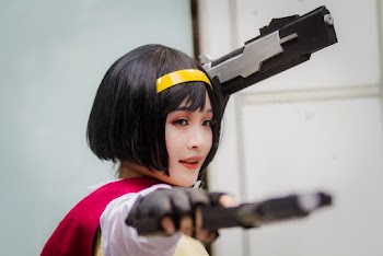 Photo Of Woman Holding Toy Guns