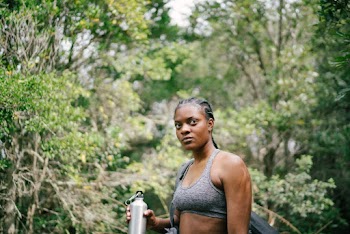 Photo Of Woman Holding Tumbler