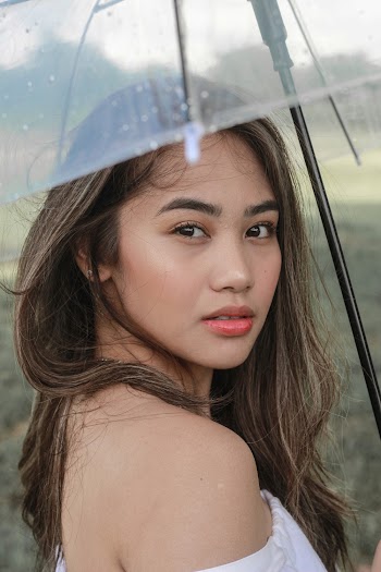 Photo Of Woman Holding Umbrella