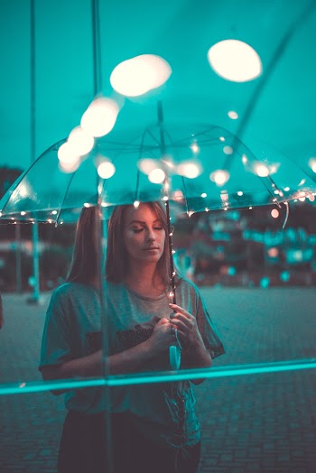 Photo Of Woman Holding Umbrella