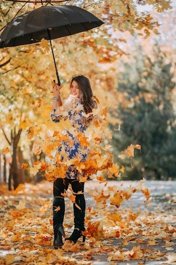 Photo of Woman Holding Umbrella