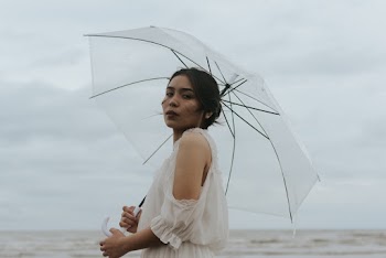 Photo Of Woman Holding Umbrella