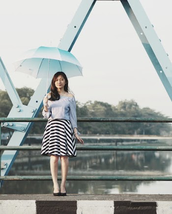 Photo of Woman Holding Umbrella