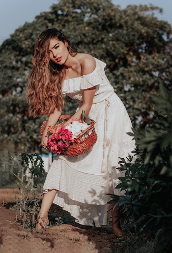 Photo of Woman Holding Wicker Basket