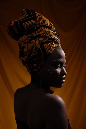 Photo of Woman in African Headscarf Posing