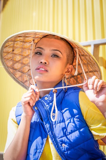 Photo of Woman in Bamboo Hat Posing