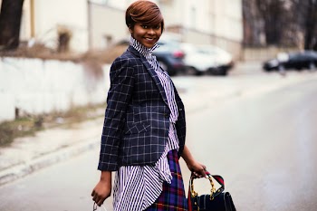 Photo of Woman in Black and Gray Blazer Holding Bag