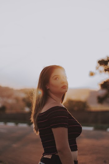 Photo of Woman in Black and Red Striped Crop Top