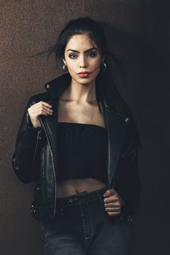 Photo of Woman in Black Outfit Posing