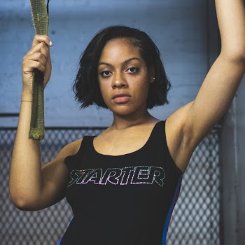 Photo of Woman in Black Starter Tank Top Posing