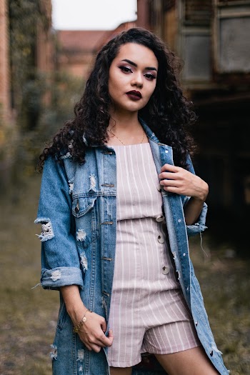 Photo of Woman In Blue Denim Button-up Jacket Posing