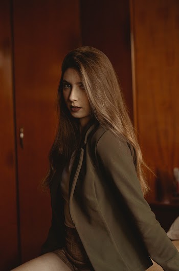 Photo of Woman in Collared Topcoat Posing