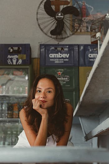 Photo Of Woman In Front Of An Industrial Cooler