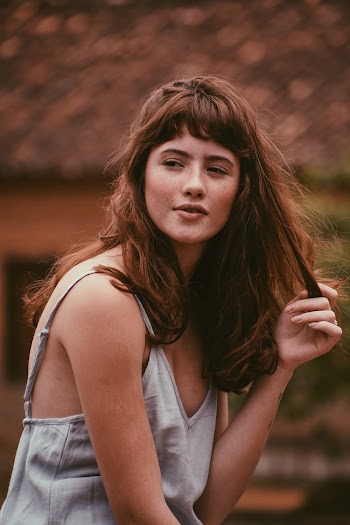 Photo of Woman in Gray Spaghetti Strap Top