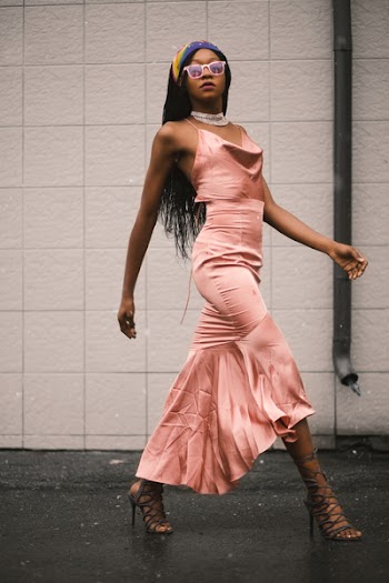 Photo of Woman in Pink Spaghetti Strap Top and Pink Long Skirt