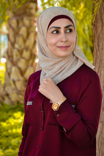 Photo of Woman in Red Abaya