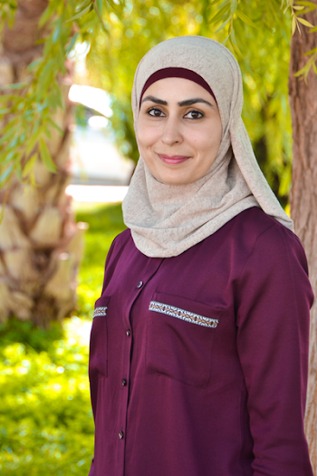 Photo of Woman in Red Abaya