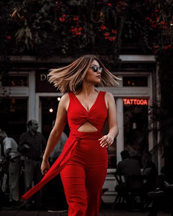 Photo of Woman in Red Outfit Walking