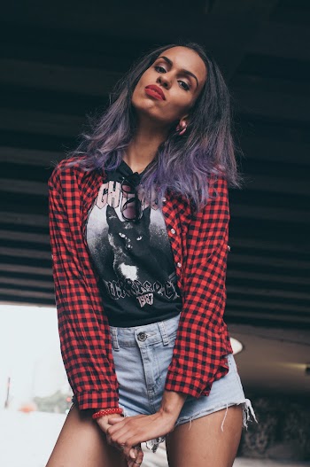 Photo of Woman in Red Plaid Shirt and Blue Short Shorts Posing