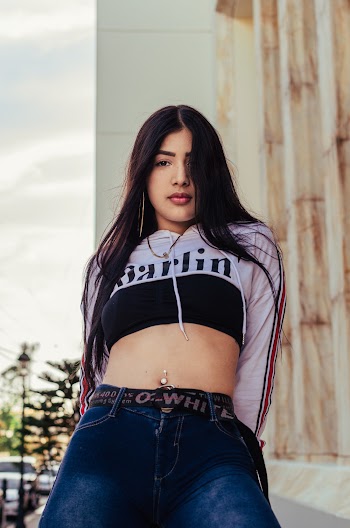Photo of Woman in Street Wear Posing