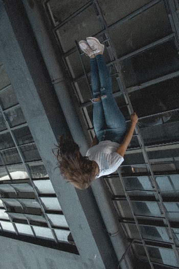 Photo of Woman in Upside Down Position