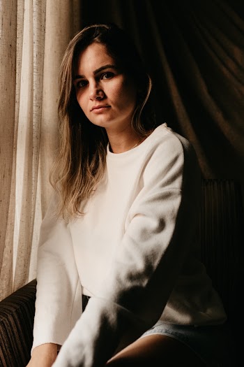 Photo of Woman in White Crew-neck Sweater