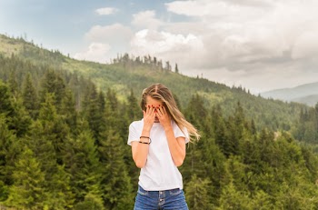 Photo of Woman in White Crew-neck T-shirt
