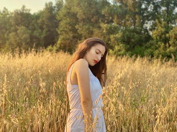 Photo of Woman in White Dress