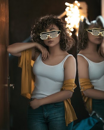 Photo Of Woman In White Tank Top