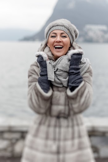 Photo of Woman in Winter Clothing Laughing