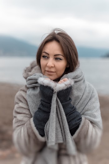 Photo of Woman In Winter Clothing Looking Away