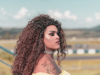 Photo of Woman in Yellow Top with Her Eyes Closed