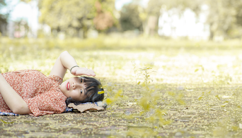 Photo of Woman Laying On Ground
